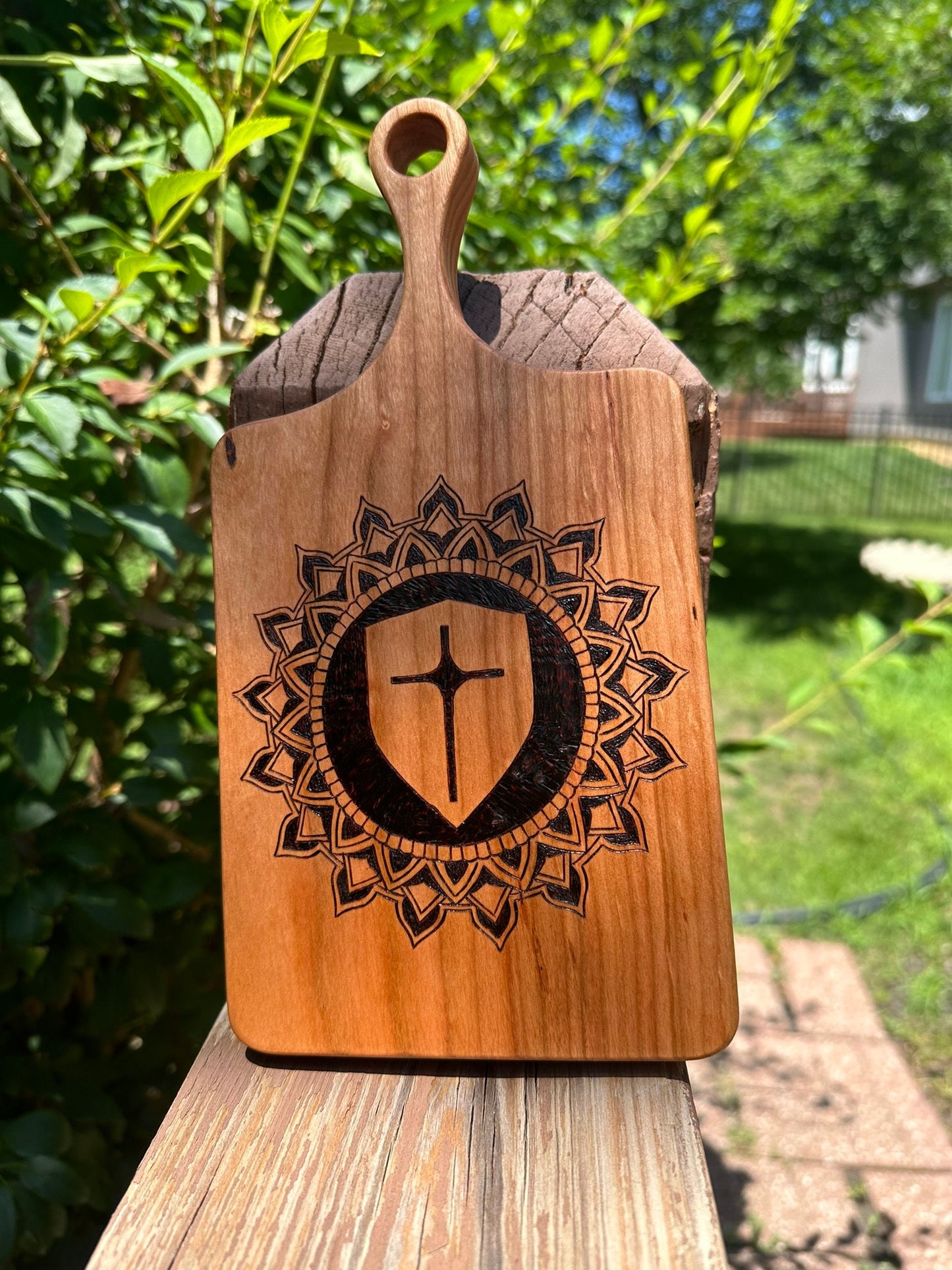 Cutting Board of Wood Burned Mandala with Cross in the center - Pyrographic concentric pattern on Cherry wood slab for charcuterie serving