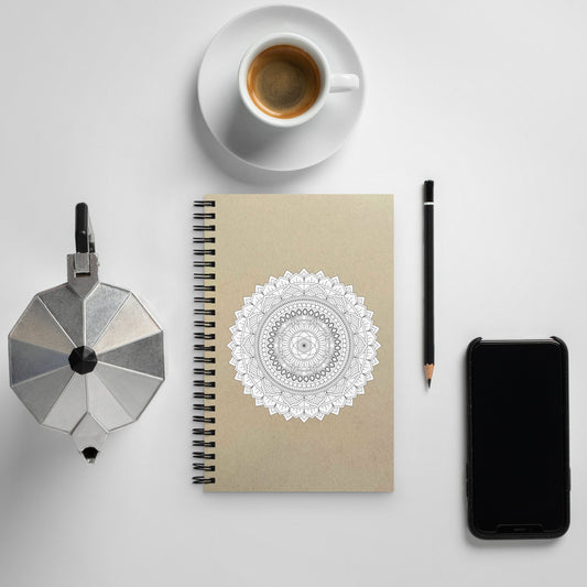 A white blank Mandala Spiral notebook with a brown paper background where you can write notes or make drawing