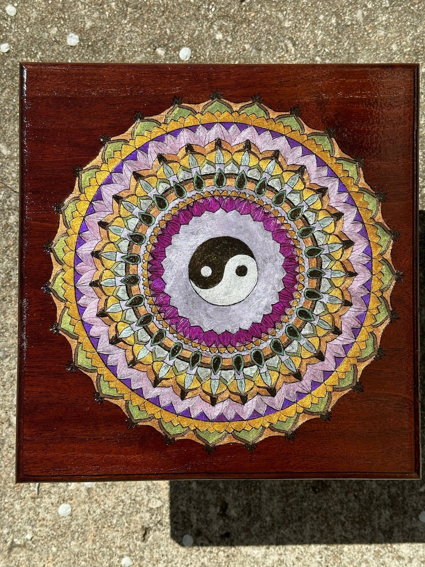 Ying Yang Mandala wood burned on reclaimed bar wood - deep reddish wood stained with a burned sienna colored stain