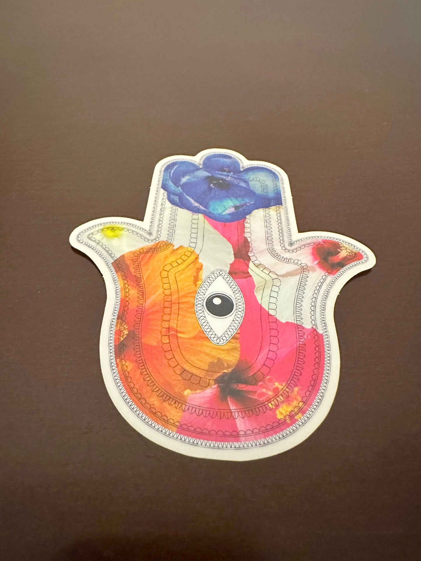Hamsa Sticker - clear sticker with flowers inlaid within the Aztec patterned hieroglyphs with an eye in the center - random floral patterns