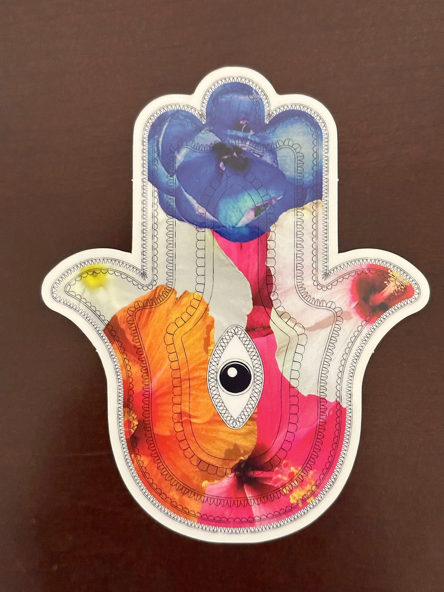 Hamsa Sticker - clear sticker with flowers inlaid within the Aztec patterned hieroglyphs with an eye in the center - random floral patterns