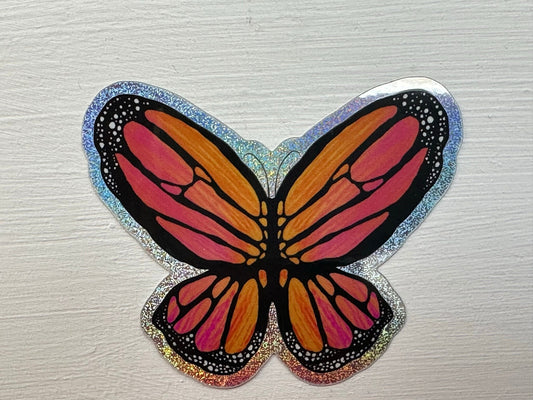 Butterfly Sticker - Pixie Dust Sticker of a Monarch Butterfly Electric Orange wings with dots on the ends  showing a multi-colored pattern