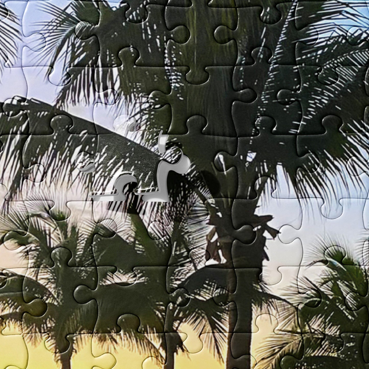 Jigsaw puzzle of the Beach in the sunset on a secluded tropical location - a set of palm trees  with chairs along a stretch of Sandy beaches
