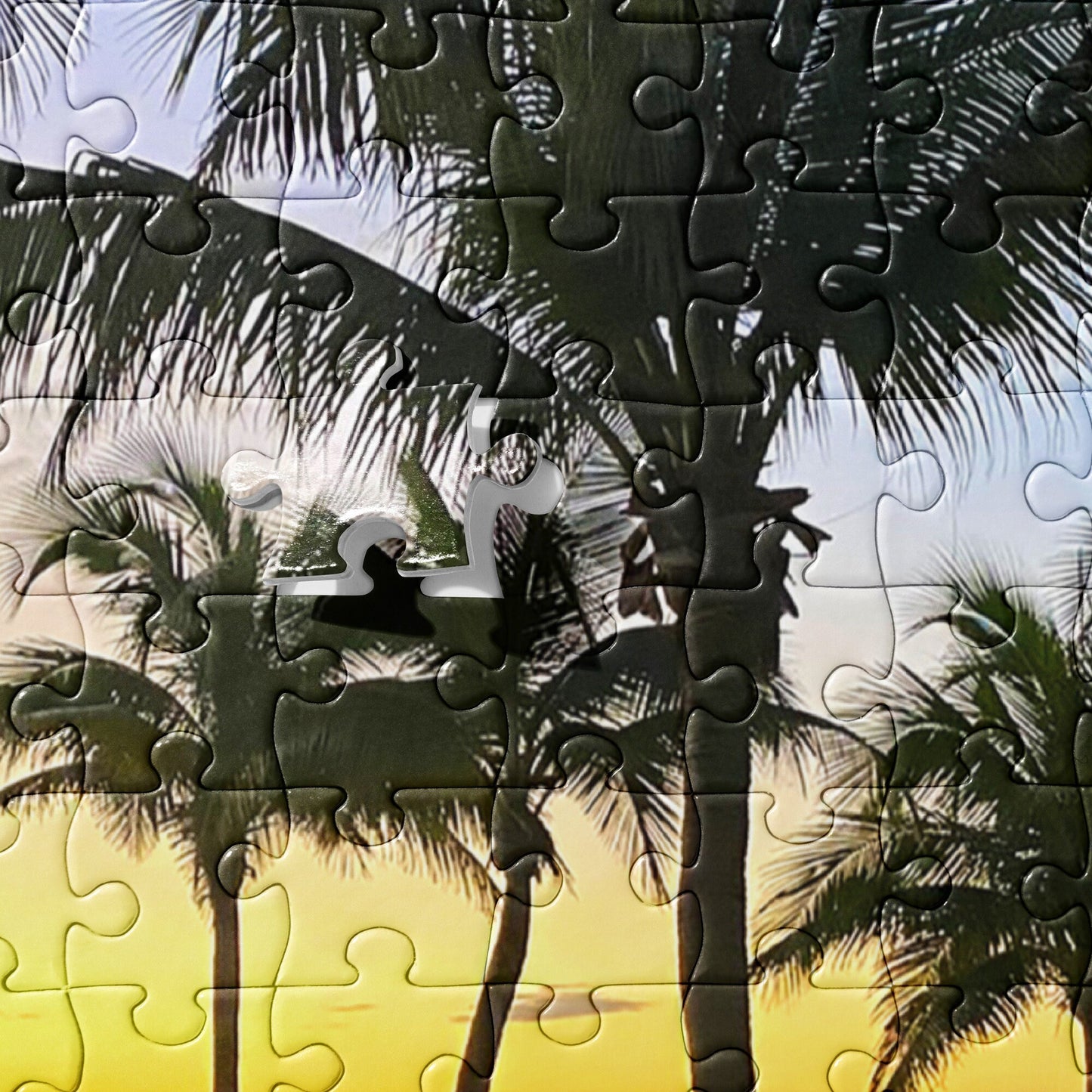Jigsaw puzzle of the Beach in the sunset on a secluded tropical location - a set of palm trees  with chairs along a stretch of Sandy beaches